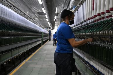 An employee works at a textile factory